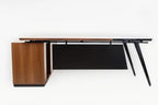 L-shape desk underside view with wood cabinet base and open black storage space