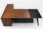 L-shape desk with warm wood tabletop and dark black side extension, angled legs