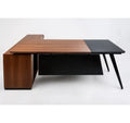 L-shape desk with wood front panel, dark black tabletop extension, slim black legs