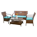 Rattan patio seating set with teal cushions, two chairs, loveseat, coffee table, bench