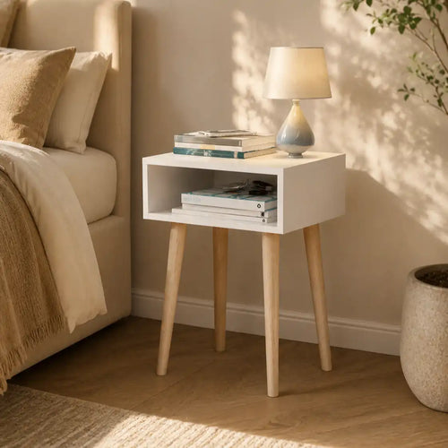 White bedside commode with open front shelf, MDF top, and four tapered wooden legs