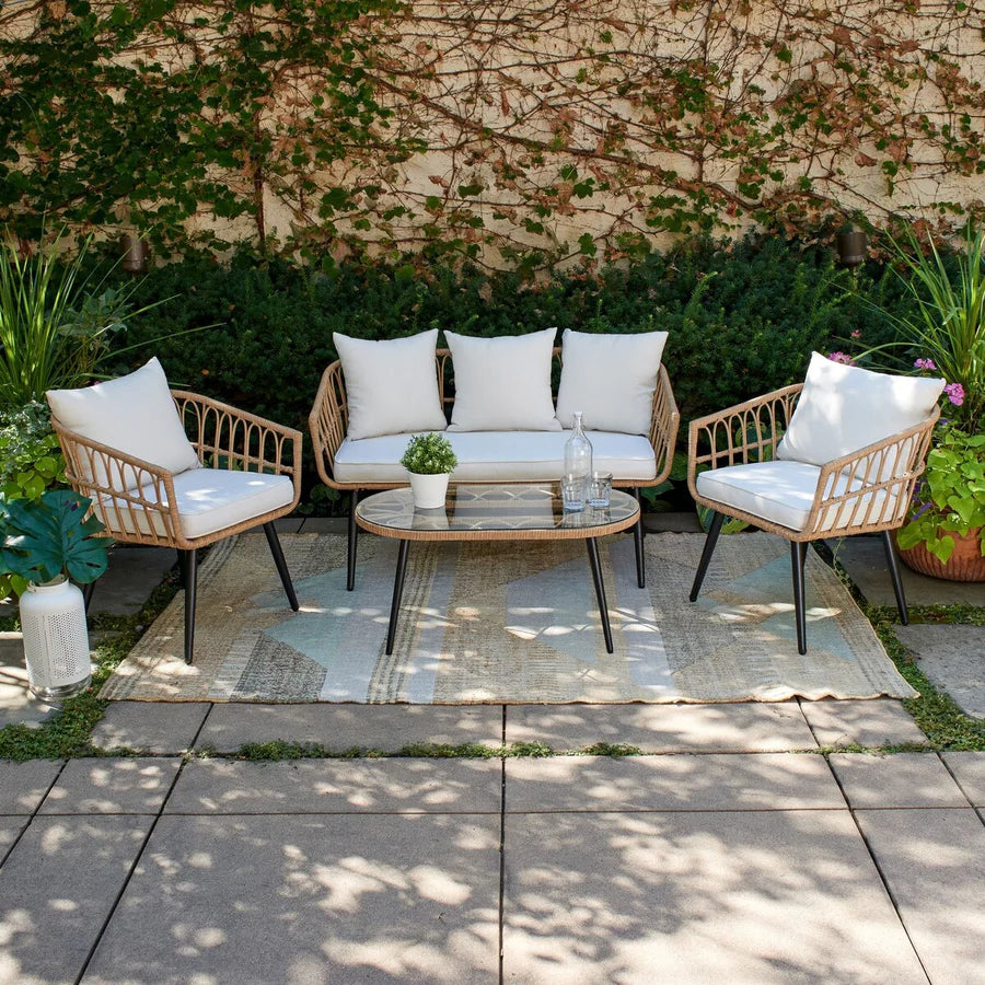 Rattan outdoor seating set with four armchairs, loveseat, round glass table, white cushions