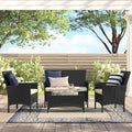 4-piece outdoor furniture set with black woven armchairs and a glass-top center table