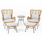 Two wicker armchairs with white cushions and round side table in between