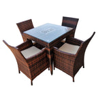 Rattan dining set for 4 with square glass-top table and four brown woven chairs