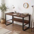 Wood-look desk with dark brown top, black metal frame, and lower open shelf