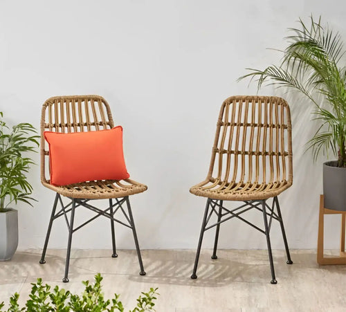 Set of 2 beige rattan cafe chairs, black metal legs, with orange seat cushions