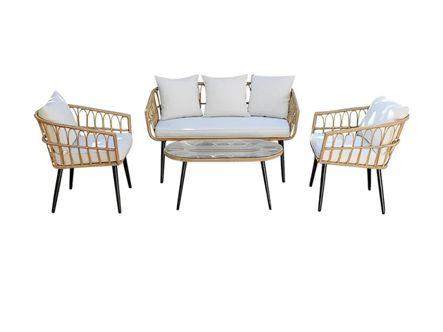Rattan outdoor seating set with loveseat, two armchairs, and round glass-top table; white cushions