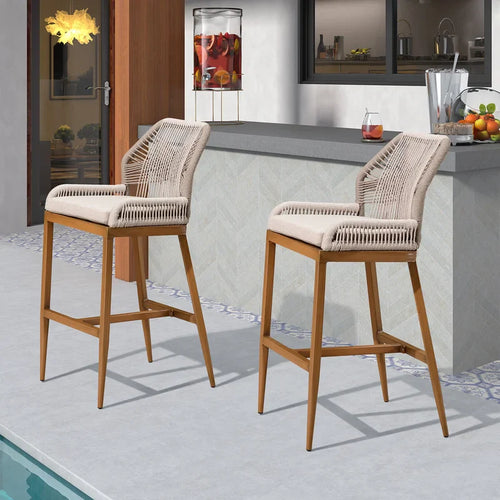 Woven bar stool with beige seat cushion and curved back, light wood frame