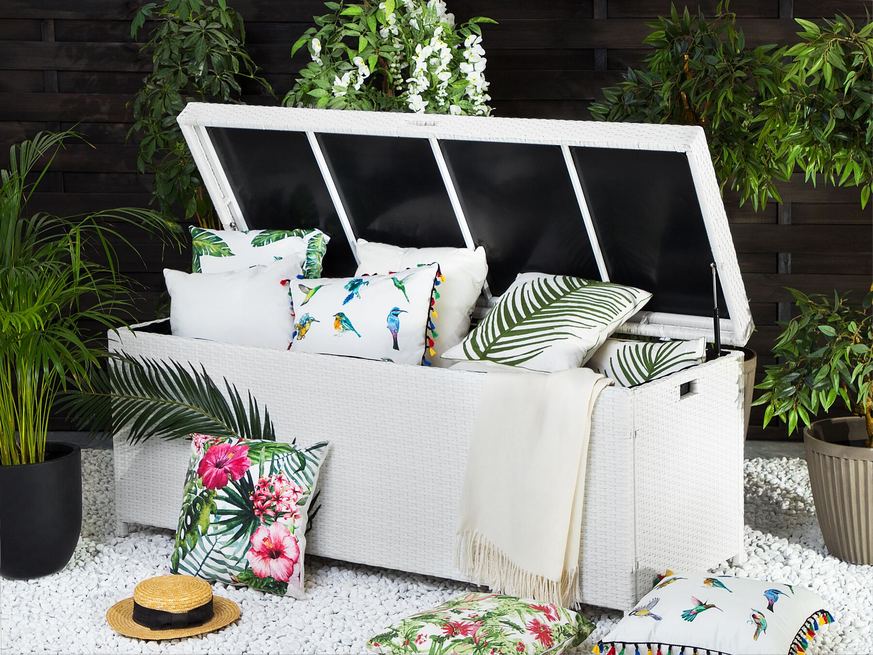 White poly rattan storage box with open hinged lid and black liner