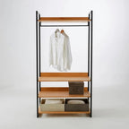 Metal clothes hanger rack with wood shelves, hanging rail, and open storage bins