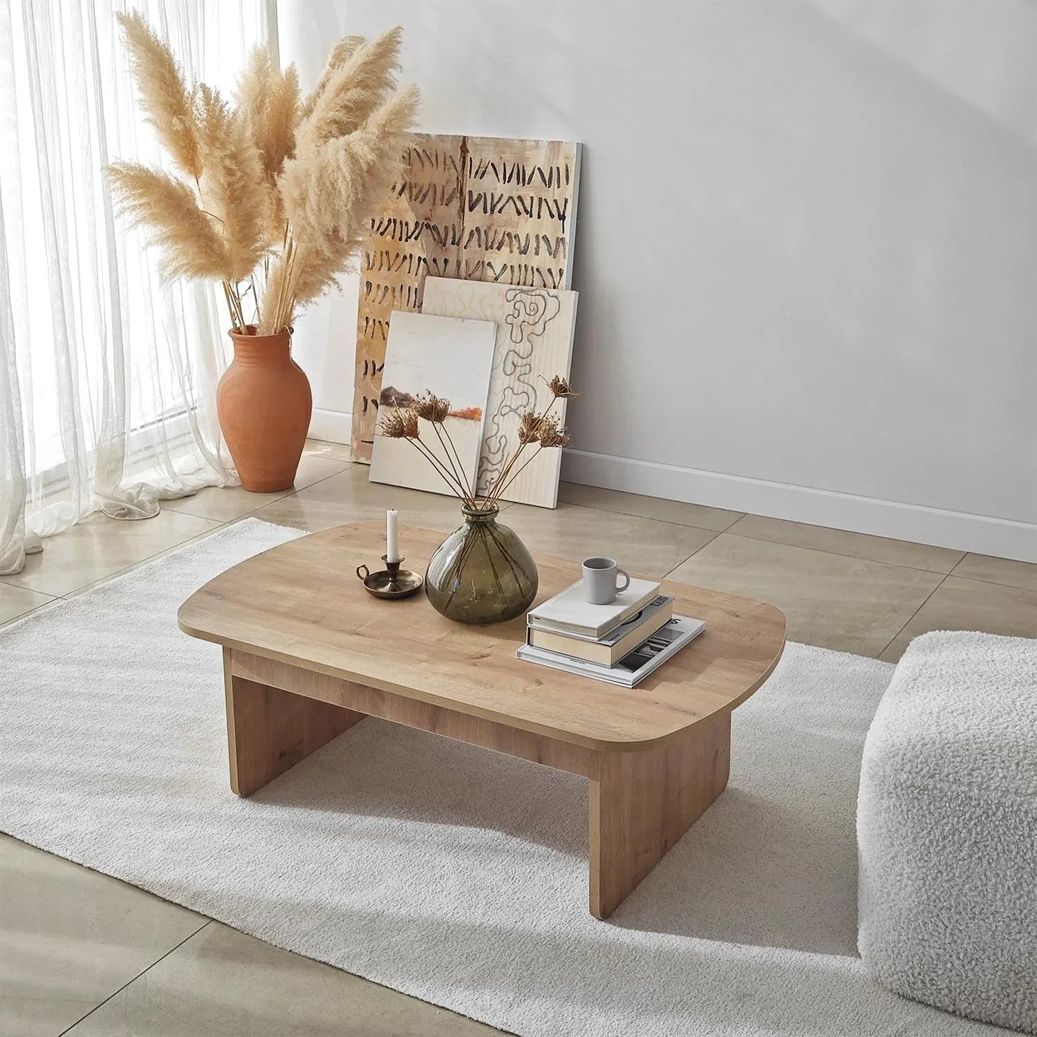 Wooden coffee table with decorative items in a living room setting