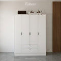 White wardrobe with four panel doors and two drawers, black handles, front view