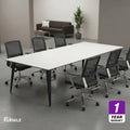 Meeting table with white top and dark legs, set with office chairs
