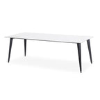 Meeting table with white tabletop and dark tapered legs