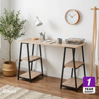 Straight desk with light wood-look MDF top, black metal legs, two-tier shelves