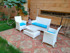 4-piece outdoor furniture set with white wicker-style chairs, blue cushions, and ottoman