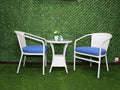 White outdoor bistro furniture set: two chairs with blue cushions and round table
