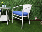 White outdoor chair with blue cushion seat and curved armrests