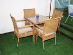 Rattan patio dining set with square glass table and four cushioned chairs