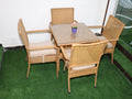 Rattan patio dining set: square glass table with four chairs and light cushions