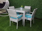 Outdoor rattan dining set for four with gray chairs and turquoise cushions around glass table