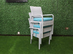 Rattan dining chair with gray woven frame and turquoise seat cushion