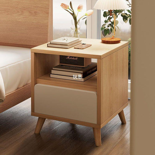 Light wood MDF commode with front drawer, open top shelf, tapered legs