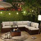 Outdoor patio corner sectional with white cushions, dark brown wicker, and square coffee table