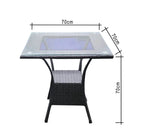 Square outdoor table with black wicker frame and clear glass top, 70cm height