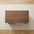 Wood-look MDF coffee table underside with four support feet and broad apron