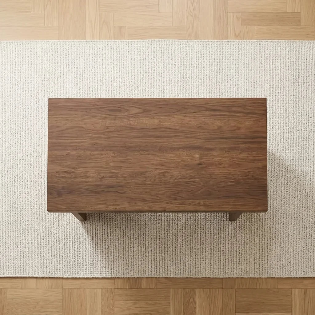 Wood-look MDF coffee table underside with four support feet and broad apron