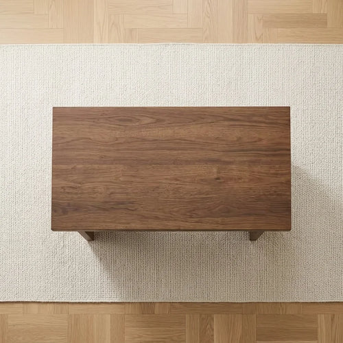 Wood-look MDF coffee table underside with four support feet and broad apron