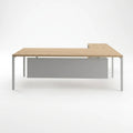 L-shaped desk with light wood top and silver metal legs