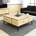 Wooden coffee table with two drawers and black legs, square top.